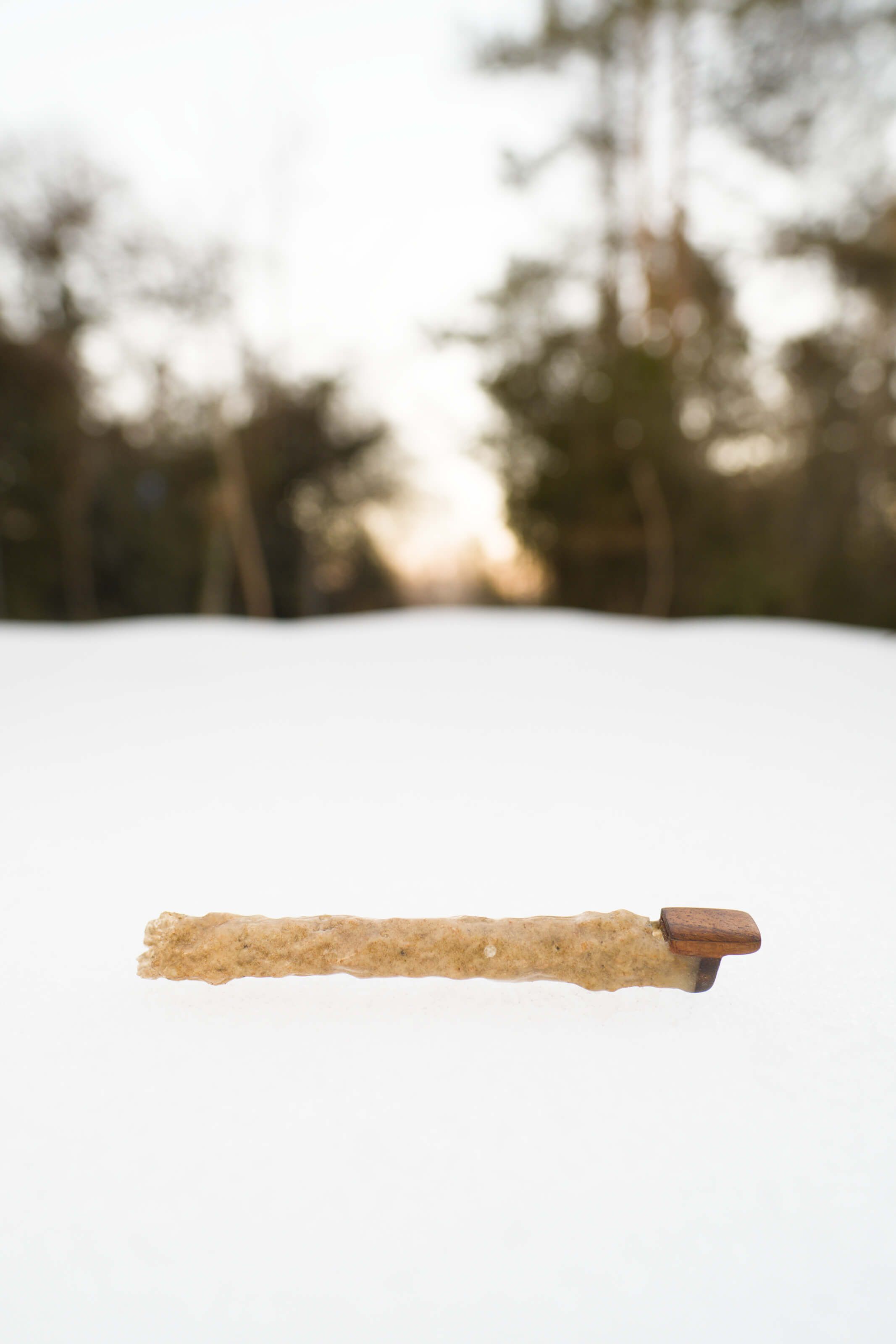 Fulgurite flute displayed as an art piece, merging natural forces with precise craftsmanship
